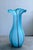 A splendidly light-hearted and graceful piece. Predominantly sky blue with wavy purple stripes and a frosted white...