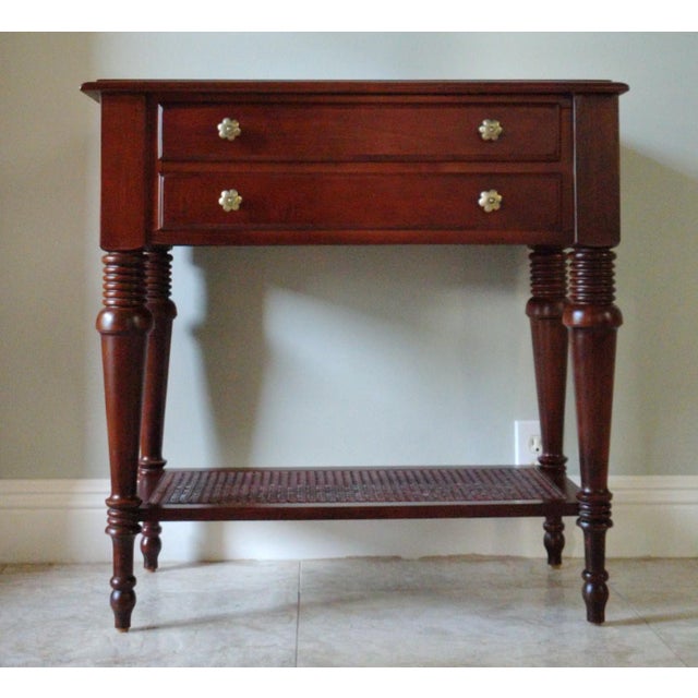 This beautiful nightstand is made by Ethan Allen. It has the island feel, fixed with woven cane shelf and two drawers...