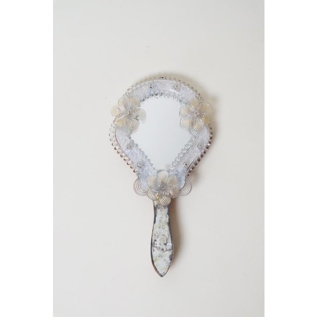 This is an exclusive Italian hand mirror with a stunning patina. This lovely mirror is from around the 1950s. It was made...