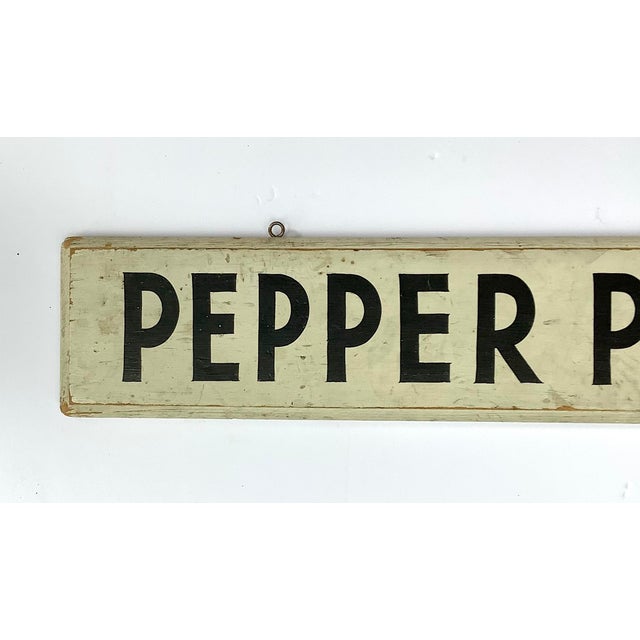 Circa 1940s two sided black and white hand lettered Pepper Plants farm stand sign with incised beveled edge. Sign has eye...