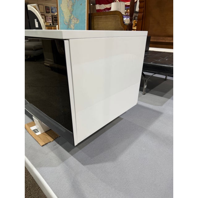Sleek, architectural, and unmistakably modern, this BDI “Marina” media console is a sophisticated storage solution...