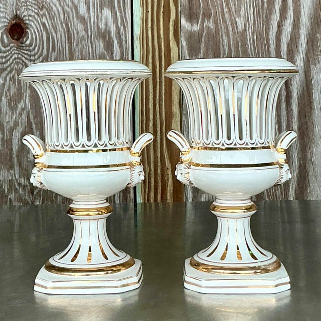 Pair of vintage Italian Impero crater vases, featuring classic urn shapes with elegant handles and intricate detailing,...