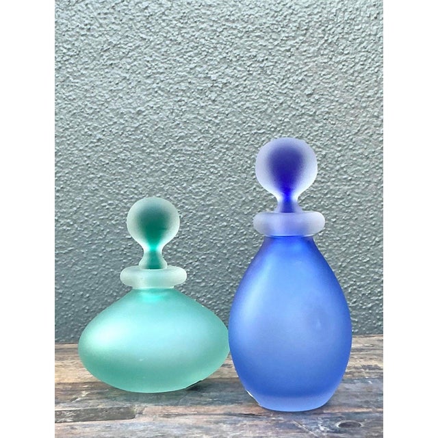 Infuse your vanity or dressing table with the ethereal beauty of this set of two vintage satin glass perfume bottles....