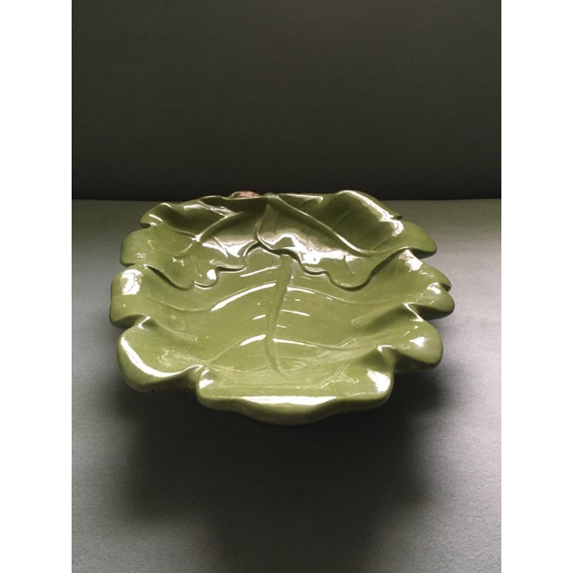 A botanically inspired vintage serving tray shaped like a fresh green leaf with flowing edges & 3 orange acorns with light...