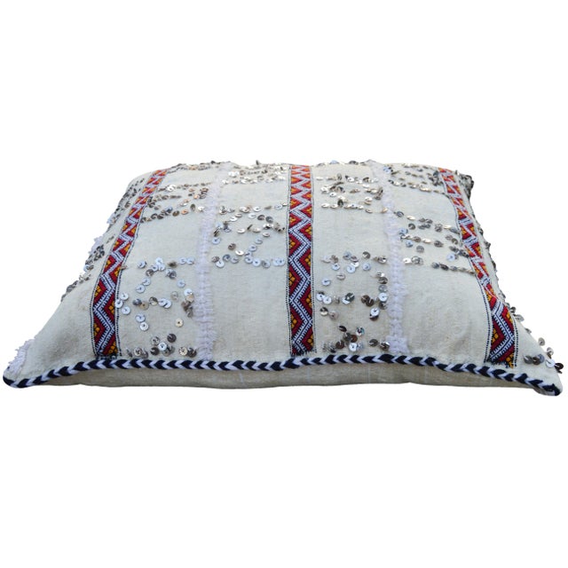 One-of-a-kind Moroccan pillow handwoven by the Berbers of the High Atlas Mountains. Features ornate stripes in a lively...