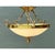 This pendant light presents a wide, shallow bowl of frosted alabaster-toned glass suspended within a substantial gilt-...