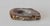 A polished brown and white agate geode slice featuring a central quartz crystal scallop cave. Exhibiting banding patterns...