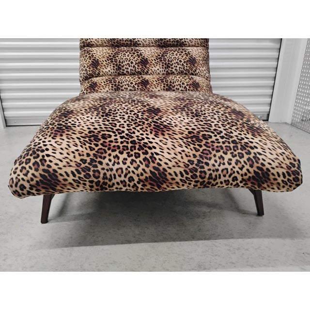 Freshly reupholstered with soft and supple velvety animal print. Ashley designs fabric. Never used since reupholstering....