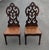 Dating back to the early 1900s, these striking wooden side chairs showcase the dramatic architectural influence of the...