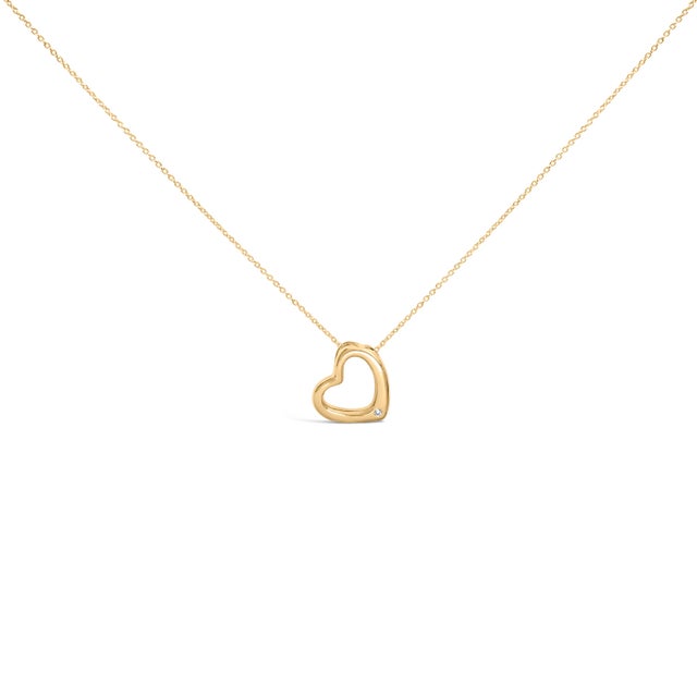 A whisper of devotion, this open heart traces a graceful loop in gleaming gold vermeil, its rounded, high‑polish edges...