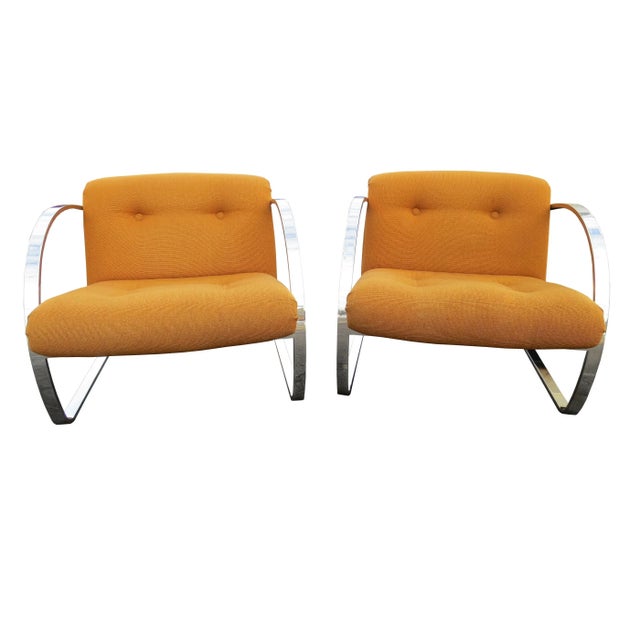 A fine pair of Arc cantilever lounge chairs by Charles Gibilterra for Brueton. Solid steel bar frame polished to a mirror...