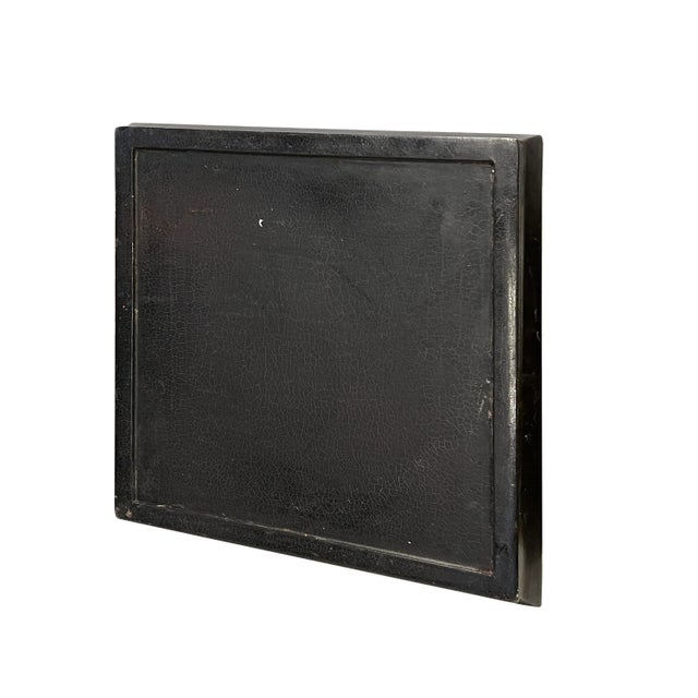 This is a decorative distressed black lacquer wooden plate tray with traditional Chinese art in matte golden color....