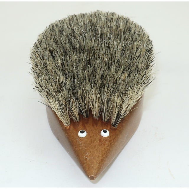 Fun, functional and frivolous...a teak wood lint brush in the shape of a hedgehog complete with natural bristles and...
