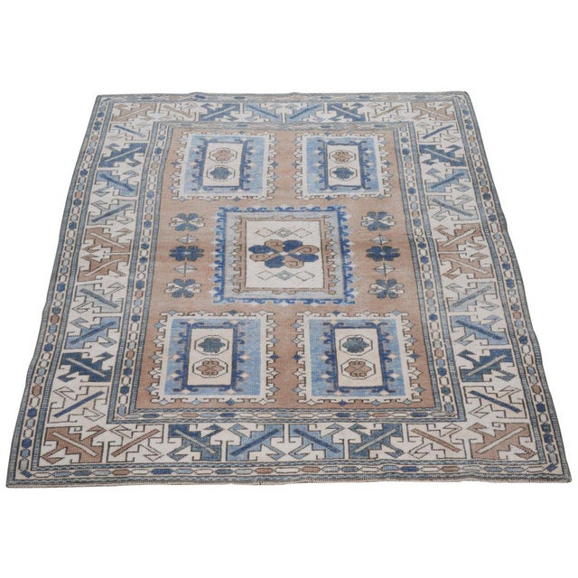 Hand-knotted with care using traditional rug-making techniques, this wool rug blends timeless craftsmanship with a modern...