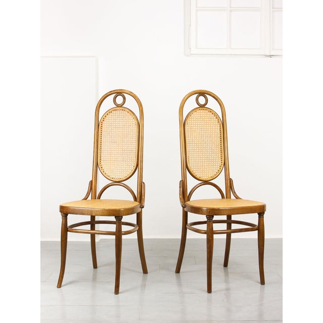 Legendary Thonet dinign chair with a high back rest. Good vintage condition. 6 available altogether. Seat height: 46cm....