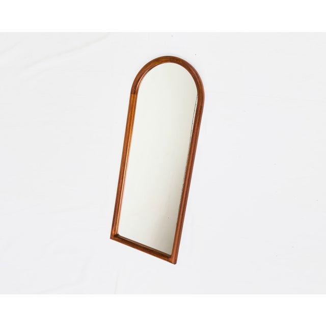 Decorative, high-quality wall mirror with a solid teak frame, made in Denmark. Hanging hardware includes a cord mounted on...