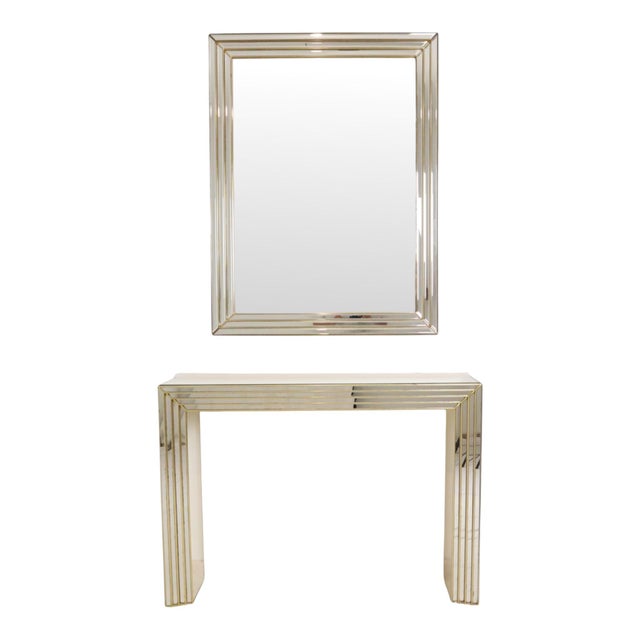 A magnificent, large designer mirror with a matching console table; this very rare set was manufactured by Deknudt (the...