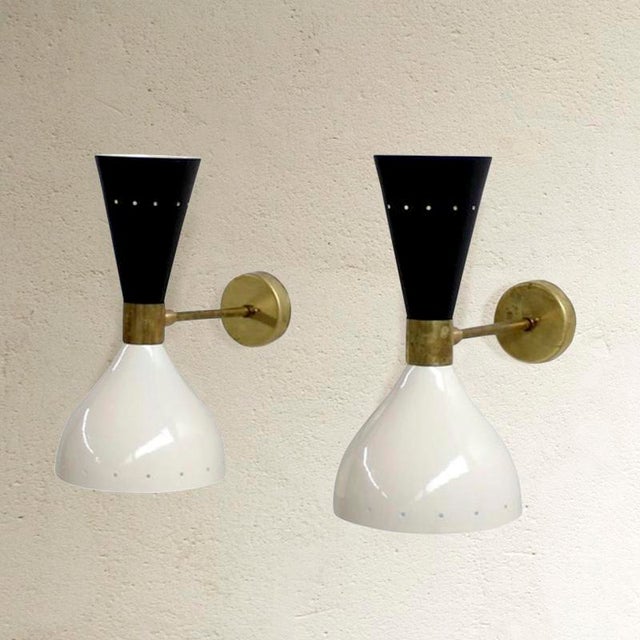 Dimensions: 28h x 15w x 31d cm pair of wall lights in aluminium and brass, adjustable with double point of light. uses e14...