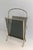 This faux bamboo magazine rack is made of bronze with blueish glass panels on each side. It is a French work from Maison...