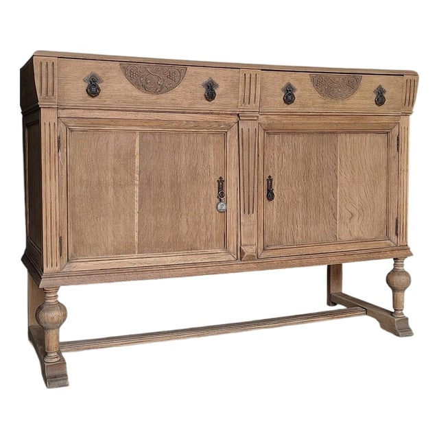 Antique English Oak Sideboard With Bun Feet and Carved Details For Sale