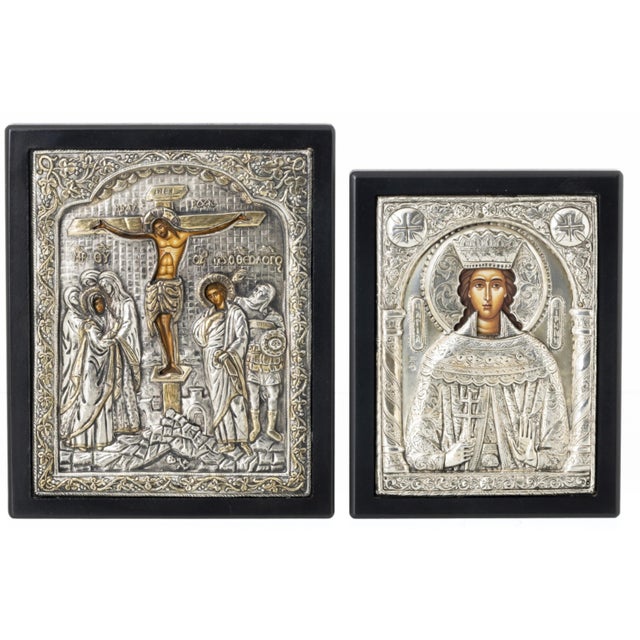 Two Orthodox icons with silver plating, 20th century Greek, wooden, 20th century, representing the crucifixion of Jesus...