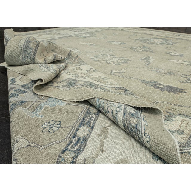 Turkish Oushak Rug Olive & Blue Handwoven Wool Rug 10'3" X 14'4" This stunning Turkish Oushak rug is a true masterpiece,...