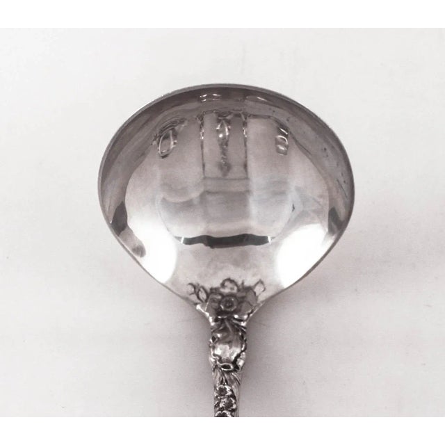We are delighted to offer this sterling silver ladle by Reed & Barton in the famous “Les Six Fleurs” pattern. One of Reed...
