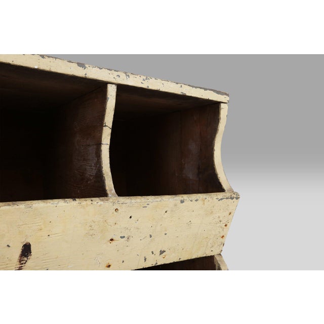 A rare and characterful industrial compartment cabinet from France, dating to around 1890. This utilitarian piece was...