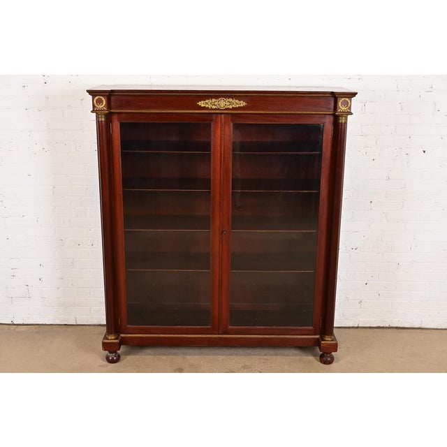 A beautiful antique French Empire or Victorian bookcase or display cabinet In the manner of Herter Brothers USA, Circa...