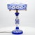A beautiful Baccarat table lamp featuring a blue overlay cut to clear crystal glass body. The intricate hand-cut patterns,...
