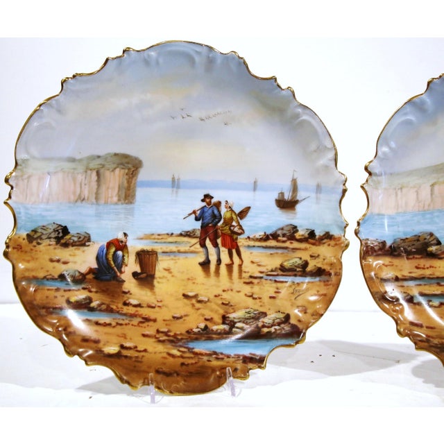 Bring color and coastal charm to an interior with this decorative pair of antique porcelain plates. Crafted in Paris,...