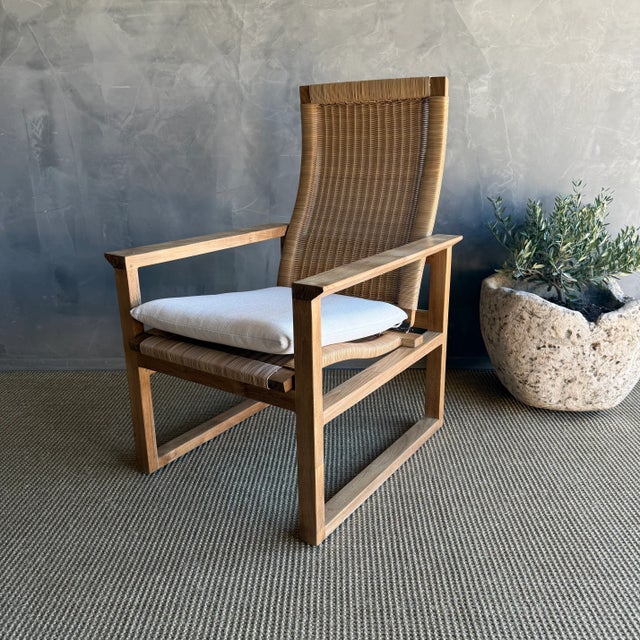 Enhance your indoor / outdoor room with this stylish Borge Collection solid teak wood lounge chair featuring synthetic...