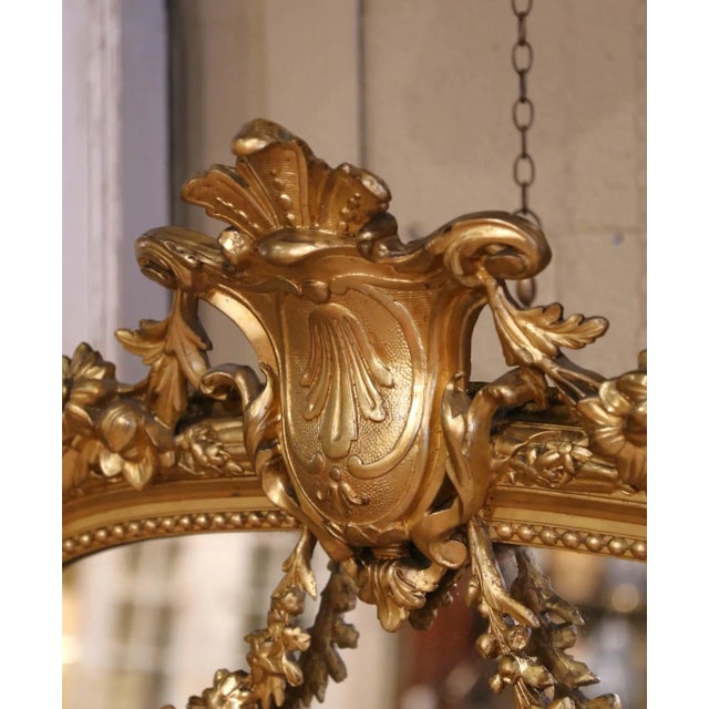 French 19th Century French Louis XVI Giltwood Mirror With Shield Crest and Floral Decor For Sale - Image 3 of 8