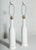 Tall Pair of A-H KAG Switzerland Off-White textured Ceramic Lamps. Featuring a slim bottle form with uniform flowing dot...
