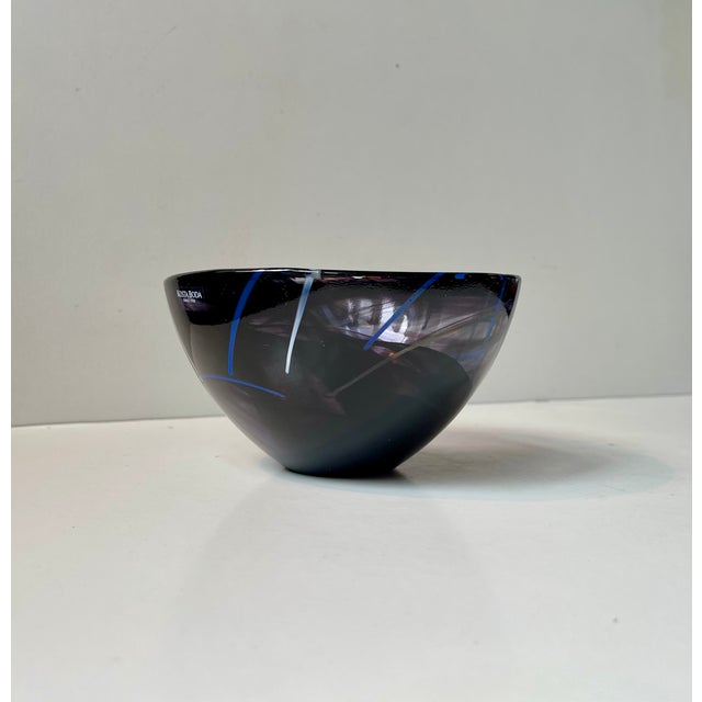 Stylish serialized art glass bowl by Swedish female designer Anna Ehrner. Manufactured at Kosta Boda during the 1990s....