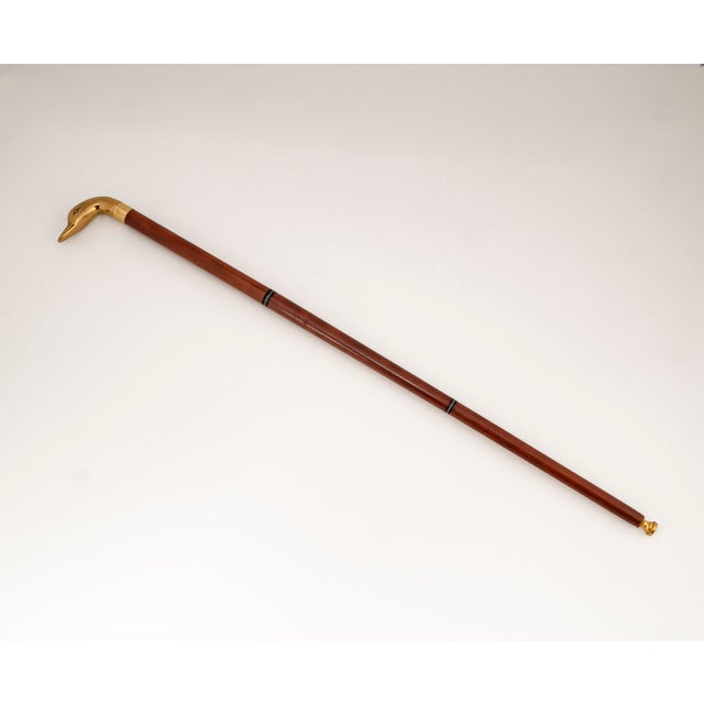 This elegant vintage walking stick combines classic British understatement with exquisite craftsmanship. The centerpiece...