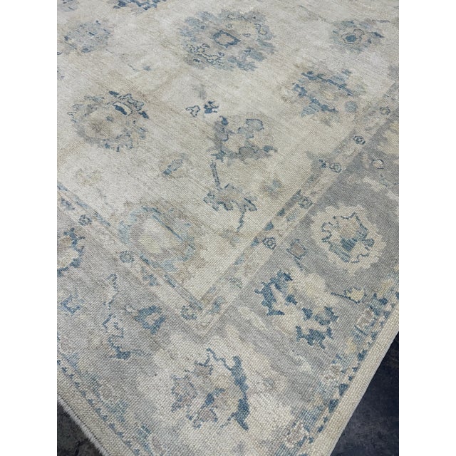 Bring a touch of timeless elegance to your home with this exquisite Turkish Oushak Oriental Hand Knotted Rug, measuring 8'...