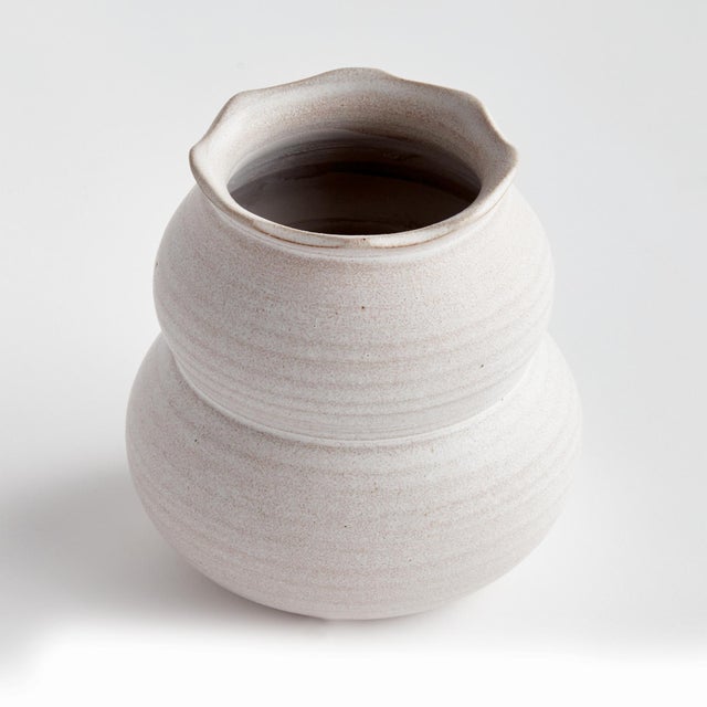 This handthrown vase has a weighty feel. Made with subtle ridges and a matte finish. The perfect little vase for a few...