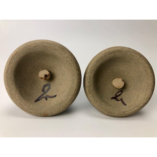 Fabulous teal colored pottery salt and pepper shakers. One is slightly larger than the other to obviously differentiate...