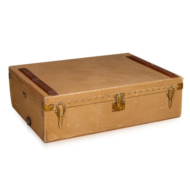 A 20th century louis vuitton motor car trunk in grey vuittonite, a rare and practical example of early automotive luggage....