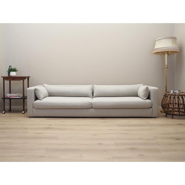 Sofa was made after 2000, Scandinavian design. The structure of the furniture is made of wood. The sofa has undergone...