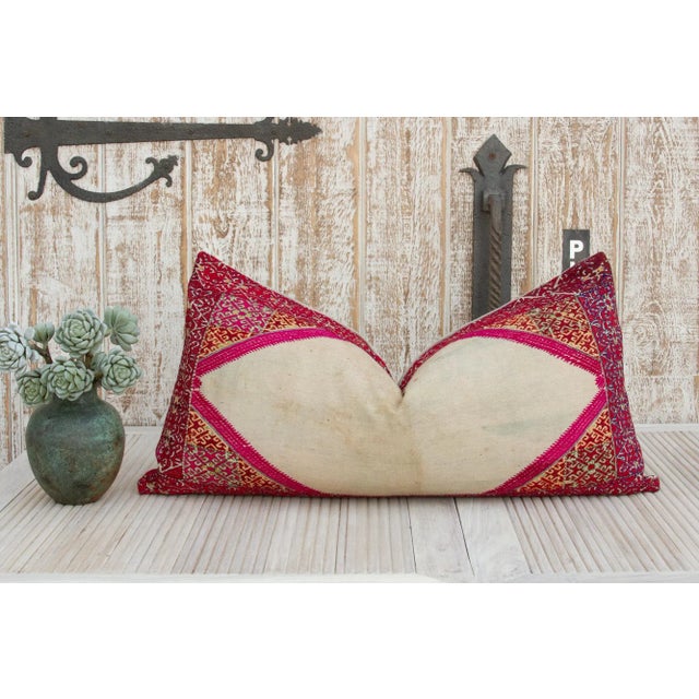 Beautiful hand-embroidered Indian lumbar pillow from the rich agricultural states of Punjab where artisans are famous for...