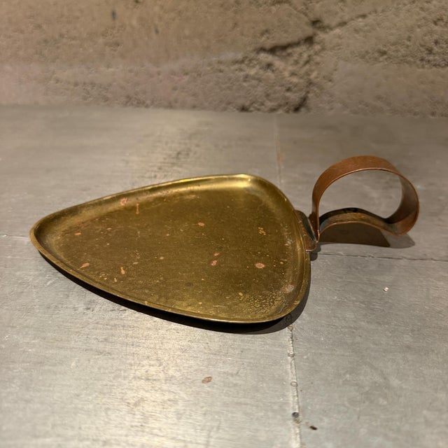 For your consideration, vintage mid-century modern item is a triangular tray fashioned from hammered brass. It features a...