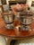 Pair of silver-plated wine coolers with flared rims, lion-mask ring handles, and reeded lower bodies. Each sits on a...