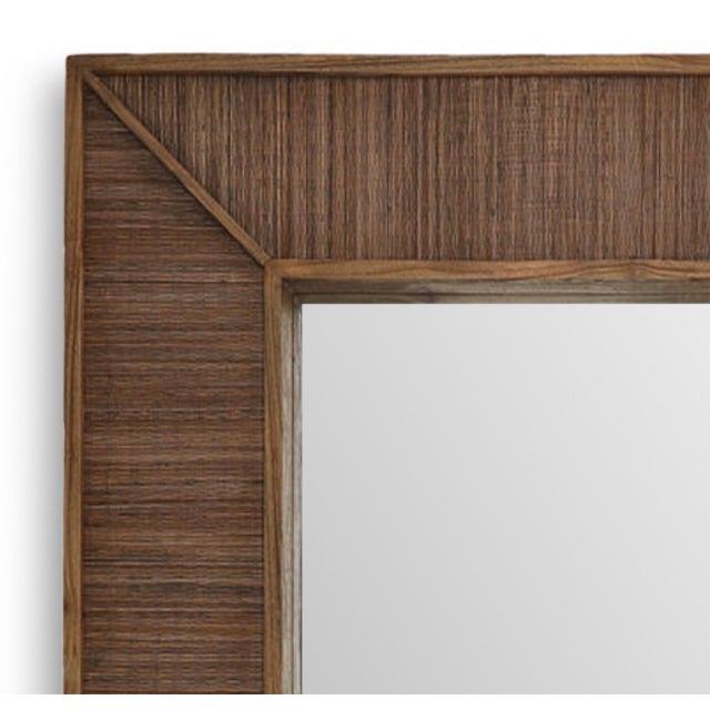 Oversized floor mirror expertly crafted from Mindi wood and hand-applied coconut fiber detailing. The richly textured...