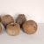 A group of seven large terracotta unglazed apples and pears, circa 1900. (Two apples, measuring 5.5" h x 6" w x 6.5" d,...