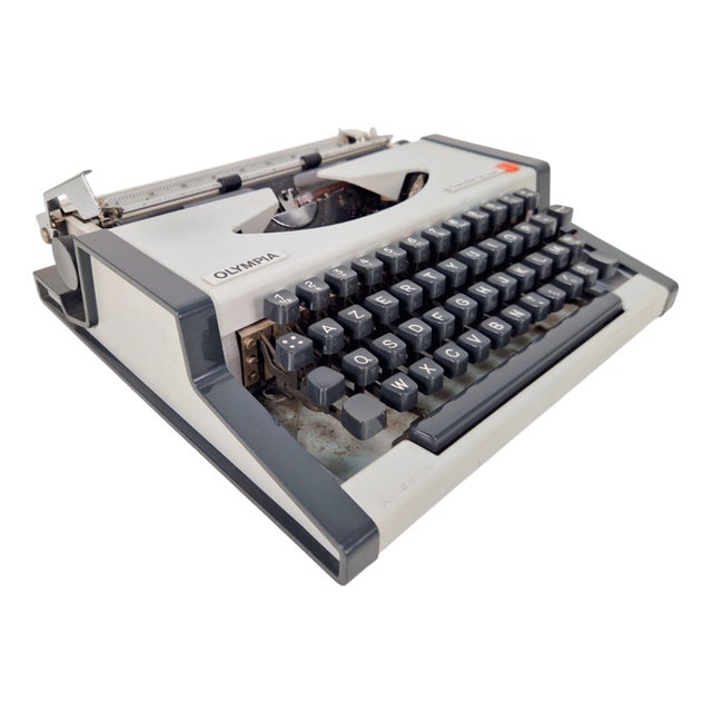 Vintage Traveller De Luxe Typewriter with Case from Olympia, 1970s For Sale