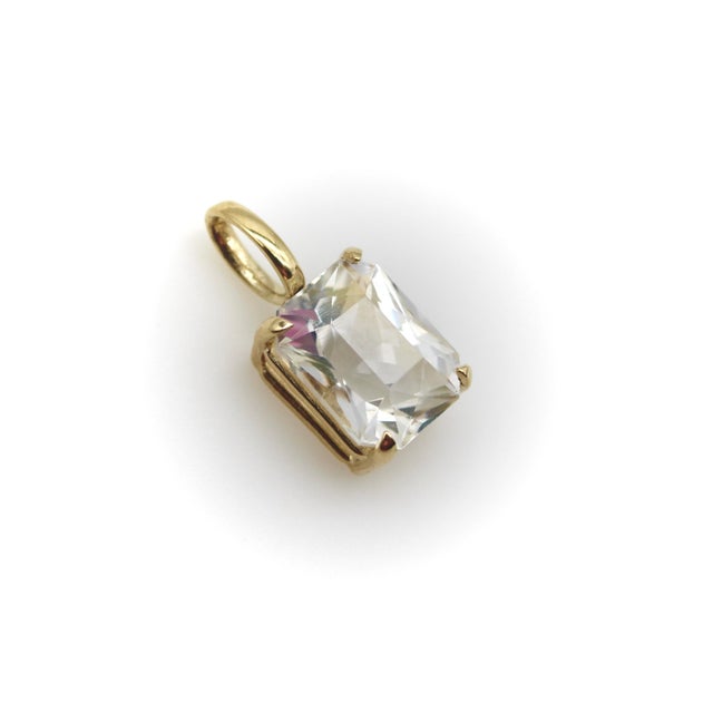 Part of Kirsten’s Corner Signature Collection, this 14k gold pendant features an incredible rectangular fancy cut...