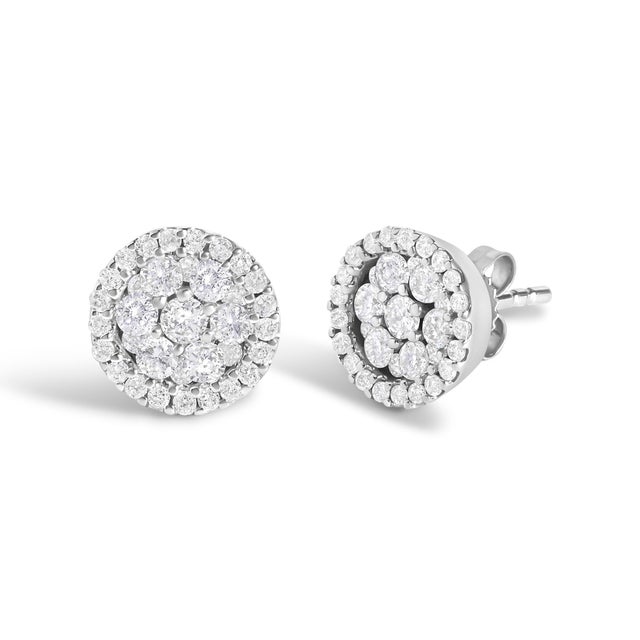 Elegant and timeless, these 14K white gold stud earrings feature round, brilliant cut diamonds in a halo style button...