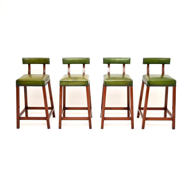 A charming and great looking set of four antique Georgian style bar stools. They were made by Kennedy of Ipswich in the...